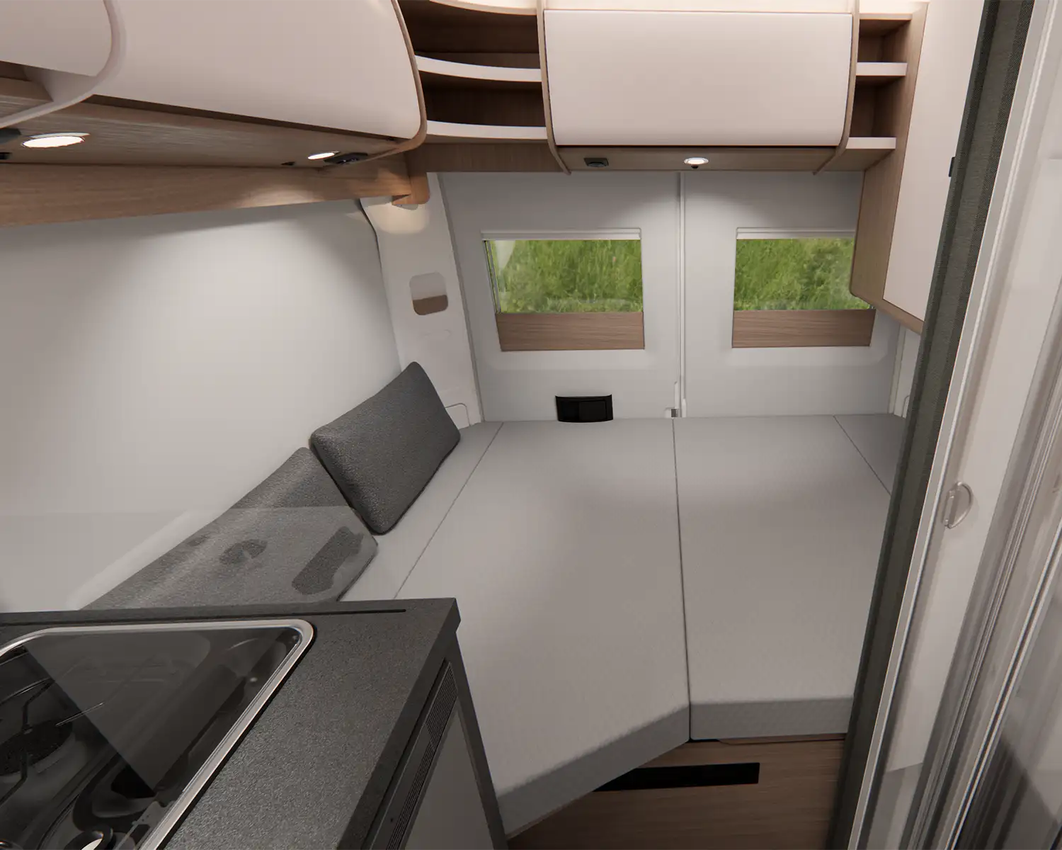 Innenansicht des Schlafbereichs eines Malibu Campervans compact mit Querbett im Heck.