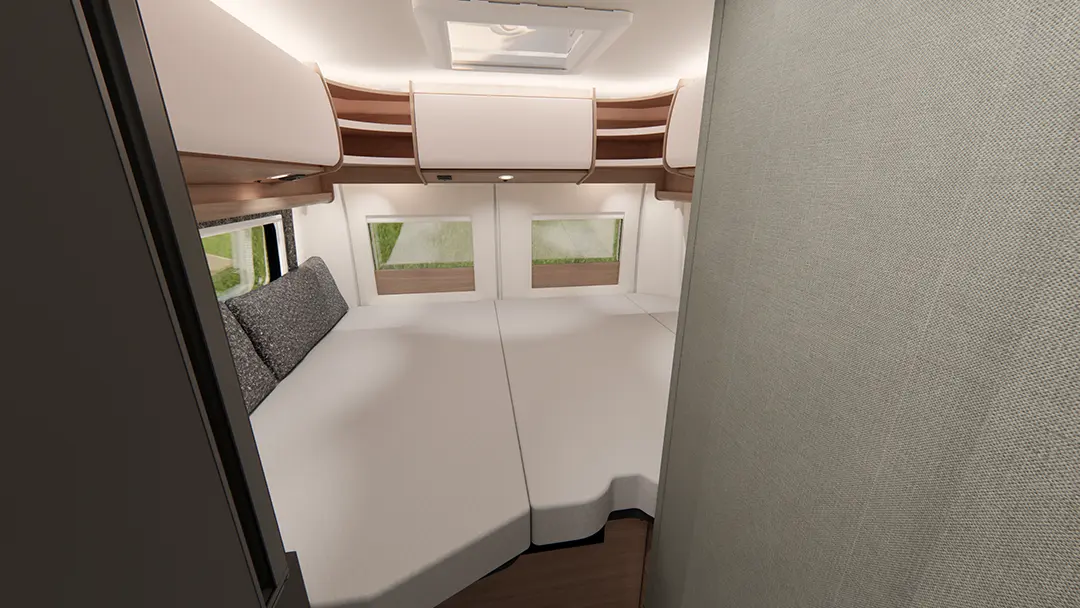 Ansicht des Schlafbereichs eines Malibu Campervans mit großem Doppelbett, sowie Rundumschränken für ausreichend Stauraum.