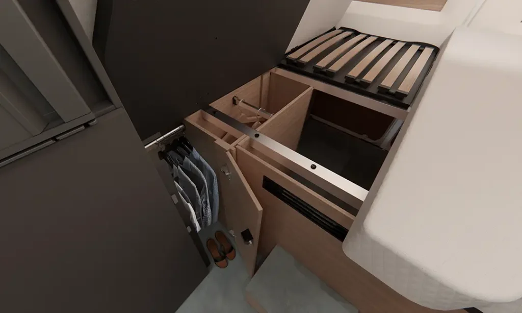 Ansicht der Stauräume unter dem Doppelbett eines Malibu Campervans mit zwei Kleiderstangen, sowie großer Heckgarage, welche durch das Hochklappen des Bettes leicht zugänglich ist.