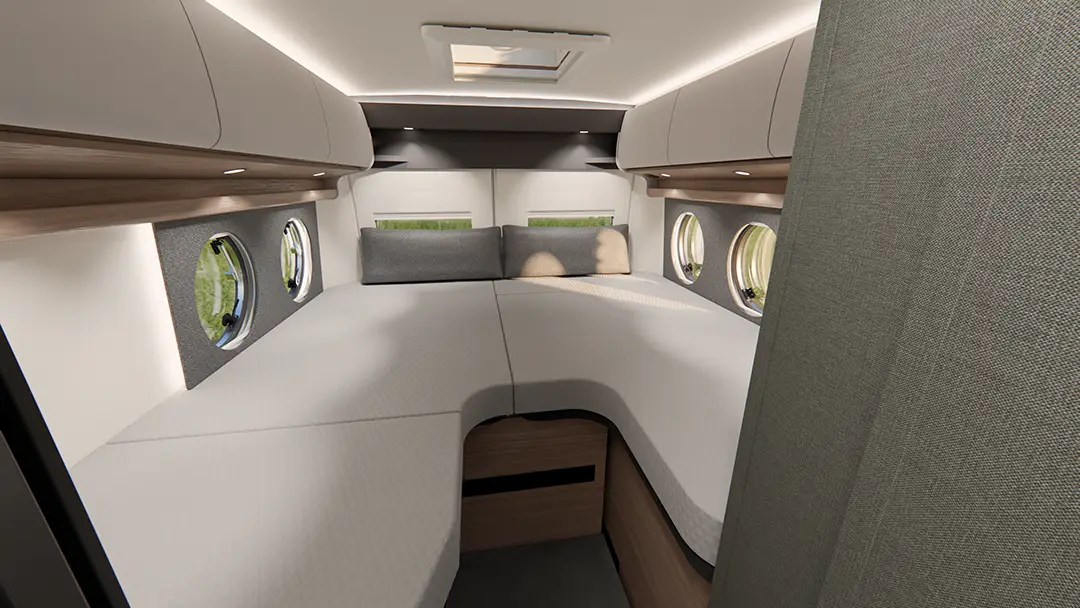Innenansicht eines Malibu Campervans mit Sicht auf die Längseinzelbetten im Heck des Fahrzeugs.